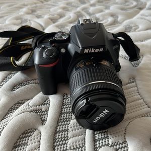 New Nikon D3500 camera with two lenses and various accessories.